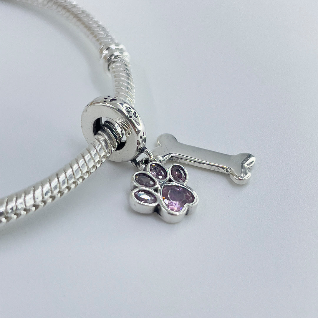Charm Huellita Rosa